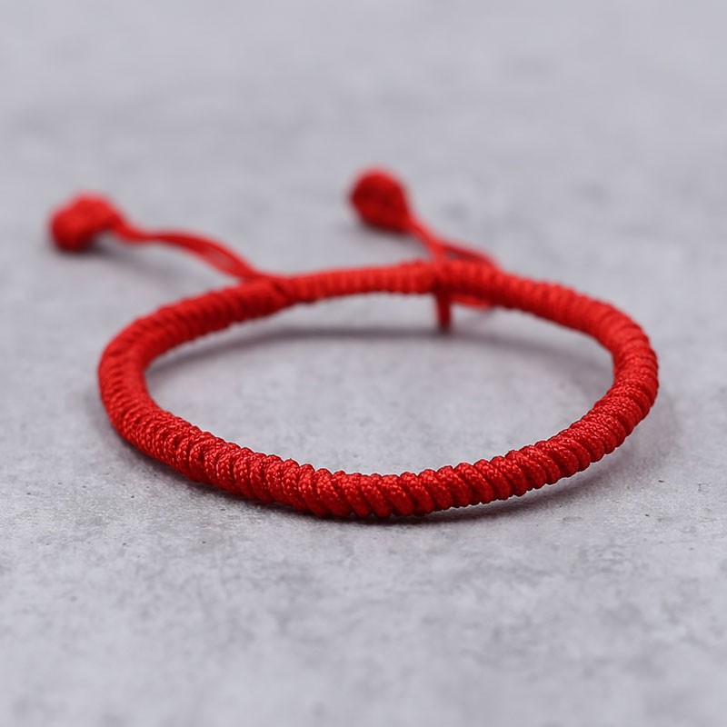 Bracelet porte-bonheur tibétain en fil rouge tressé